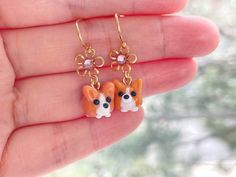 These Pembroke Welsh Corgi earrings are cute and dainty, which is a perfect gift for kids, friends and dog mom.  It is made of the following: 🔹 Corgi (Size: H10 x W10 x D11mm) : It is handmade glass beads. Each bead is unique so there is a slightly different from bead to bead. 🔹 Flower: gold plated over brass with purple glass crystal 🔹 Earring hooks: gold plated over brass 💛 NECKLACE 💛 https://www.etsy.com/listing/1413758183 【PLEASE NOTE THE FOLLOWINGS BEFORE PURCHASE】 ✔ VAT, GST and any o Cute Handmade Orange Jewelry, Cute Orange Handmade Jewelry, Orange Novelty Jewelry For Gifts, Orange Novelty Jewelry For Gift, Novelty Orange Jewelry For Gift, Beads Earrings Gold, Puppy Jewelry, Corgi Cute, Bead Flower