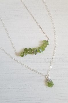 Peridot: The birthstone for August. A crystal rich in culture, mysticism and healing power. A stone that helps to boost the confidence of those wearing it, as well as attracting luck, love & wealth. Brings peace & harmony to one's life. TWO Piece Necklace Layering Set! Gorgeous raw green Peridot is elegant yet rustic. This is a two piece layering necklace set. Your choice of Sterling Silver or Gold Filled. Solid lobster claw clasp. Details: * Natural raw Perdiot nugget chips Size: Betwee Spiritual Peridot Jewelry With Gemstone Accents, Spiritual Peridot Jewelry With Gemstone, Spiritual Peridot Gemstone Jewelry, Peridot Gemstone Beads Necklace As Gift, Peridot Gemstone Bead Necklace For Gift, Peridot Gemstone Beads Necklace For Gift, Peridot Jewelry With Natural Stones For Healing, Necklaces For Her, Raw Peridot