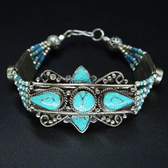 Handmade Tibetan Silver Bracelet With Turquoise Gemstones. Very Striking Pieces, Direct From Nepal, Beautiful Traditional Ethnic Design. Will Be Energetically Charged By A Reiki Master Traditional Blue Beaded Bracelets For Festivals, Traditional Blue Bracelets For Festivals, Southwestern Style Blue Bangle Bracelets, Blue Bracelets For Festivals As A Gift, Blue Bracelets For Festivals And Gifts, Southwestern Style Blue Bangle Bracelet, Blue Bracelets Gift For Festivals, Blue Festival Bracelets Gift, Turquoise Bracelet For Festivals