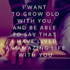 someone is sitting on top of a suitcase with their hand resting on the handle and saying, i want to grow old with you and be able to say that i have lived