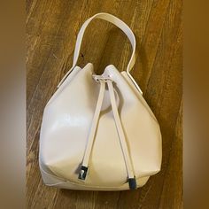 Nwot Forever 21 Cream Bucket Bag With Dual Straps - Small. Pu Leather Bucket Bag With Drawstring Closure. Comes With An Adjustable And Detachable Shoulder Strap And Attached Short Strap. Easy To Change The Bucket Purse Into A Crossbody Bag, Single Shoulder Bag Or A Top Handle Handbag. Silver-Tone Hardware. Brand New Bag. Never Used. Kept In Storage. Excellent Condition. Pet Friendly And Smoke Free Home. Bundle For Best Deal. All Sales Are Final. No Returns Or Exchanges. Forever 21 Bags, Bucket Purse, Top Handle Handbags, Leather Bucket Bag, Leather Bucket, Mini Bags, Best Deal, New Bag, Mini Bag