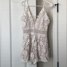 Never Worn! Cute White/Nude Lace Romper With See-Through Detail Around The Waist. Summer Lace V-neck Jumpsuits And Rompers, White V-neck Jumpsuits And Rompers For Brunch, White Chic Jumpsuits And Rompers For Brunch, Summer Lace Jumpsuits And Rompers With V-neck, Chic White Jumpsuits And Rompers For Brunch, Summer Lace Jumpsuits With V-neck, Spring Lace V-neck Jumpsuits And Rompers, White Summer Jumpsuits And Rompers For Party, Summer Party Cream Jumpsuits And Rompers