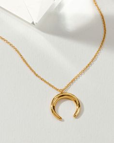 Crafted with a dainty chain and boasting beautiful golden plating, this necklace is perfect for every skin tone. Plus, it's extremely versatile! Perfect for layering with other necklaces or wearing solo – you won't need anything else.For five years now, the Crescent Horn Charm has been a customer favorite! Whether you're traveling the world on an adventure or living life at home, this charming necklace makes any day special. An effortless addition to any look – athleisure or otherwise. Get ready Gold Crescent Necklace Tarnish Resistant, Minimalist Crescent Brass Necklaces, Gold Crescent Moon Charm Necklaces, Gold-plated Crescent Necklace With Adjustable Chain, Crescent Horn Necklace, Easy Costumes, Necklace Craft, Foodie Gifts, Bachelorette Gifts