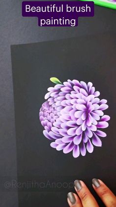 a person holding up a purple flower with the words beautiful brush painting on it's side