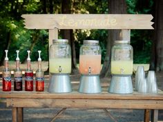 a table topped with jars filled with drinks