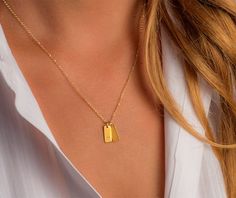 Solid Gold Tag Necklace Set of 2 Smooth Initial hand stamped | Etsy Minimalist 14k Gold Jewelry With Hallmarks, Minimalist Yellow Gold Name Necklace As Gift For Her, Minimalist Yellow Gold Name Necklace For Her, Minimalist Yellow Gold Name Necklace Gift, Minimalist Yellow Gold Engraved Initial Necklace, Minimalist Engraved Yellow Gold Initial Necklace, Minimalist Yellow Gold Nameplate Charm Necklaces, Minimalist Yellow Gold Initial Nameplate Necklace, Everyday Yellow Gold Jewelry With Hallmarks