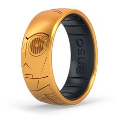 a gold and black ring with an emblem on it