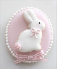 a decorated cookie in the shape of a bunny