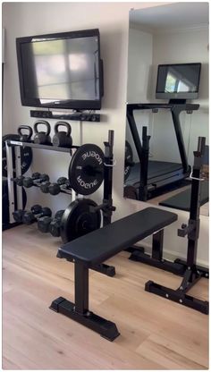 there is a television and gym equipment in the room