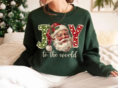 Joy To the World Sweatshirt, Santa Shirts, Christmas Sweatshirt, Joy Sweater, Gift For Christmas, Peace Sweatshirt, Christmas Gift For Women 📢Please Check All Photos For Details.   📢Choose Your T-Shirt Size From The Drop-Down Lists Next To The item Picture   📢Choose Of Your T-Shirt Color From The 2nd Picture   📢Use "Add message to Seller" link On The Checkout Page To Send me the Following important Details For Your Order's Customization.   📢Shipping Time Varies by location (we are located i Feel The Joy Christmas Sweater, Christmas Peace, Christmas Gift For Women, Business Notes, Santa Shirts, Sweater Gift, Sweatshirt Christmas, Joy To The World, Comfort Color