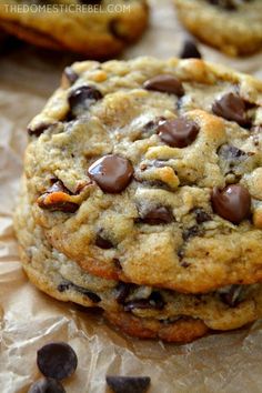 chocolate chip cookies are stacked on top of each other