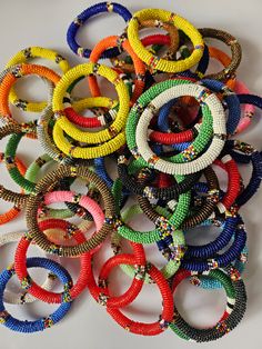 Wholesale African beaded bangles, Maasai bangles, African hand jewelry, A set of 20 maasai bangles. African beaded bangles made with quality beads.  This listing is for 20 assorted bracelets. All my items are shipped through DHL Express anywhere in the world. Custom orders are welcome. Colorful Beads Bangle For Festivals, African Bangles, Beaded Bangles, African Bracelets, Bangles Making, Stylish Bracelet, Bead Bangles, Maasai, African Beads