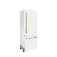 a white refrigerator freezer with gold handles