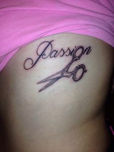 a woman's stomach with scissors and the word passion tattooed on it