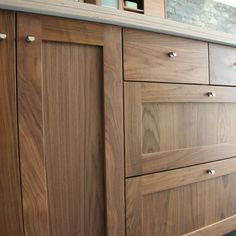 a kitchen with wooden cabinets and granite counter tops