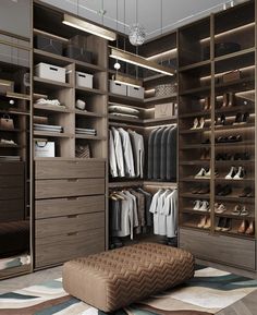 a walk in closet filled with lots of drawers and shoes on top of shelves next to a footstool