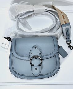 Authentic COACH Beat Saddle Bag. BRAND NEW with tags. Includes 2 crossbody straps. Photos are of the actual bag you will receive (*stock images are for reference).   Product Details:  Color:  Sage / Gunmetal Hardware Coach Beat Saddle  Style No. C3738 Glovetanned leather Inside zip and slip pockets Snap closure, fabric lining Outside open pocket Detachable strap with 21 1/2" drop for shoulder or crossbody wear Includes interchangeable webbing strap with 25" drop Approx. 9" (L) x 7 1/2" (H) x 2 1/4" (W) Sage Blue, Gunmetal Hardware, Webbing Strap, Saddle Bag, Bag Brand, Saddle Bags, Snap Closure, Saddle, Stock Images