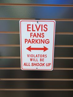 a red and white sign that reads elviss fans parking violators will be all shock up