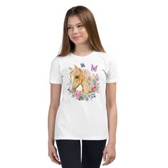 Our charming Youth T-Shirt adorned with a breathtaking Palomino horse, delicate floral motifs, and enchanting butterfly design. This fashion-forward tee will make your little one feel as graceful as a butterfly and as elegant as a Palomino horse. The soft and breathable fabric ensures maximum comfort, while the vibrant colors and intricate details bring this unique masterpiece to life. Whether your young adventurer wears it casually or dresses it up, this T-shirt is a delightful addition to any Trendy Short Sleeve T-shirt With Butterfly Print, Cute Butterfly Print T-shirt For Spring, White Unicorn Print T-shirt For Summer, Casual Pink T-shirt With Butterfly Print, Summer White T-shirt With Unicorn Print, Casual Unicorn Print T-shirt For Spring, Cotton T-shirt With Unicorn Print For Spring, Palomino Horse, Casual Multicolor Butterfly Print T-shirt