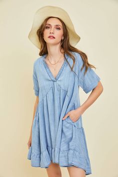 Have fun wearing this Jolene Chambray Mini Dress every day, featuring a swingy silhouette and convenient pockets. The vintage pigment wash gives each dress a unique and one-of-a-kind look, with intentional variations in texture, distress, and shade. These are not defects, but a result of the special dye and washing process. Details: Color: Washed Denim Blue Size: S-3XL Material: 100% Tencel Chambray Short Sleeve Dress With Pockets, Short Sleeve Chambray Dresses With Pockets, Washed Blue Chambray Dress With Pockets, Relaxed Fit Chambray Dress With Pockets, Casual Acid Wash Summer Dress, Medium Wash V-neck Dress With Pockets, Relaxed Fit Chambray Summer Dresses, V-neck Medium Wash Dress With Pockets, Medium Wash Dress With Pockets And Relaxed Fit