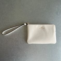 Coach White Wristlet Wallet, New With Tags Inside! Chic On-the-go Wristlet Clutch, Chic Wristlet With Zipper Pouch, Chic Zipper Pouch Wristlet, Coach Clutch With Removable Pouch For Daily Use, Classic Everyday Bag With Wrist Strap, Classic Everyday Bags With Wrist Strap, Coach Clutch Pouch For Everyday Use, Everyday Coach Wallet With Removable Pouch, Chic Clutch Wristlet For On-the-go