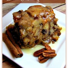 a white plate topped with cake and pecans