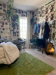 a bedroom with green carpet and wallpaper on the walls is pictured in this image