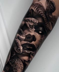 a man's arm with a snake on it and a woman's face