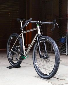 a bike parked in front of a garage door