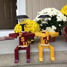 flowers and decorations on the front steps of a house