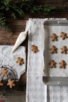 some cookies are sitting on top of white paper