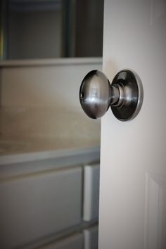 an open door with two knobs on it