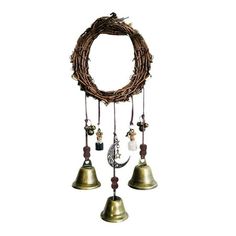 two bells hanging from the side of a wreath