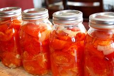 several jars filled with different types of food