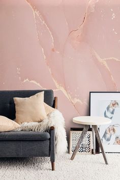 a living room with pink walls and white carpet