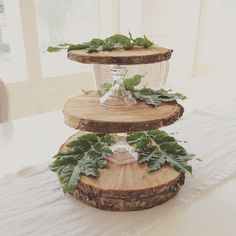 three tiered cake stand decorated with greenery