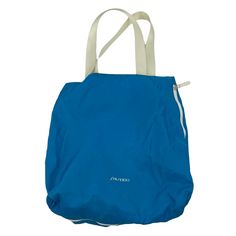 a blue tote bag on a white background