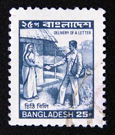 an old stamp with the image of two people shaking hands in front of a hut