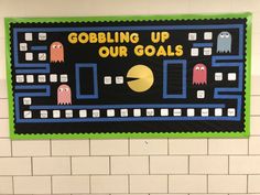 a bulletin board that says gobbling up our goals with pacman faces on it