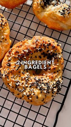 four bagels on a cooling rack with the words 2 ingredient bagels above them