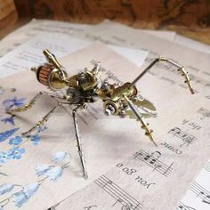 This stunning sculpture is a one-of-a-kind creation that showcases the beauty and intricacy of steampunk design. It is made from clockworks and tiny metal parts that have been carefully assembled to form a realistic and detailed insect shape. The sculpture has a metallic shine and a vintage charm that will appeal to any fan of metal, mechanical or steampunk art. It is a perfect addition to your collection or a unique gift for someone special.  Specifications: Name: Steampunk Ant Color: As Shown Steampunk Kunst, Steampunk Home Decor, Diy Steampunk, Metal Model Kits, Steampunk House, Metal Puzzles, Steampunk Diy, Model Hobbies, Insect Art