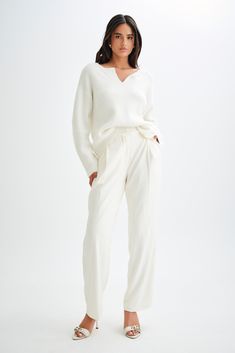 A warm embrace.The JENELLE Fluffy Oversized Jumper is the epitome of cozy chic. With its V neckline and open design, this jumper offers a relaxed and stylish look. The long sleeves and slouchy fit make it perfect for layering, providing both comfort and warmth. Crafted from a fluffy, unlined knit, the Jenelle Jumper is ideal for snuggling up in style during the colder months. Chic Relaxed Fit V-neck Sweater With Long Sleeves, Elegant Fine Knit Loungewear Sweater, Elegant Fine Knit Sweater For Loungewear, Oversized V-neck Chic Sweater, Oversized Neutral V-neck Sweater, Elegant V-neck Sweater For Loungewear, Chic White Long Sleeve V-neck Sweater, Elegant Soft Knit Loungewear Sweater, Elegant Soft Knit Sweater For Loungewear