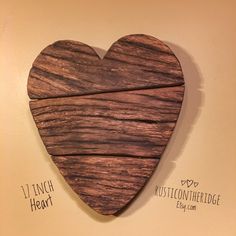 a wooden heart hanging on the wall