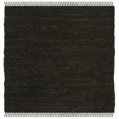 a black and white rug with fringes on it