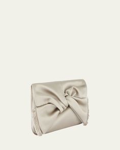 Anya Hindmarch clutch bag in sleek doubleface satin, knotted into a bow with fringe    Flap top with magnetic closure    Interior card pocket    Lining: Suede    Approx. 5.9"H x 8.2"W x 1.9"D    Imported Anya Hindmarch Bag, Bow Clutch, Anya Hindmarch, Bergdorf Goodman, Magnetic Closure, Clutch Bag, Tops Designs, Sleek, Satin