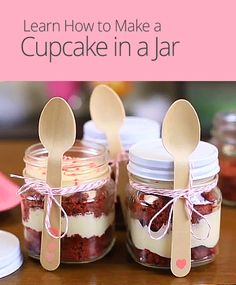 three jars with spoons in them sitting on a table next to some other items