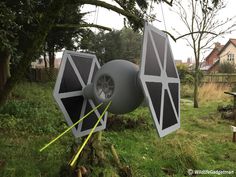 a star wars themed object in the grass