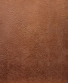 a brown leather texture background or wallpaper that looks like it has been painted with some paint