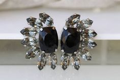 #jewelry #earrings #clusterearrings #studearrings #motherofthebride #elegantearrings #blackgrayearrings #promjewelry #statementearrings #clusterearrings #blackdiamond #eveningearrings #blackcrystalstuds #cocktailjewelry #blackdressearrings #formalearrings Elegant Black Diamond Party Earrings, Glamorous Black Crystal Earrings For Wedding, Glamorous Black Formal Earrings, Elegant Black Bridal Earrings For Formal Occasion, Blue Earrings Wedding, Purple Wedding Jewelry, Earrings Prom, Evening Earrings, Formal Earrings