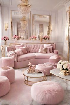 a living room filled with pink furniture and decor